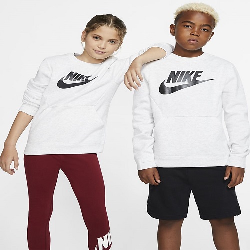 Two kids wearing white Nike sweatshirts.