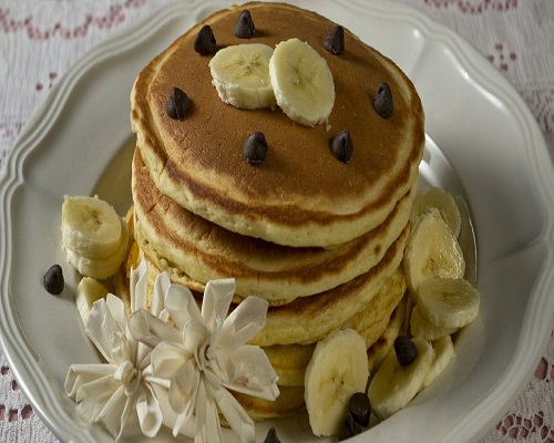 stack of pancakes with bananas