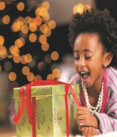 African American Girl Opening Gift