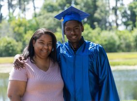 low-income mom and Son College Graduate free tuition