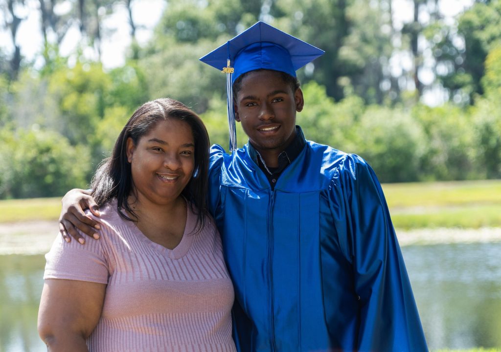 low-income mom and Son College Graduate free tuition